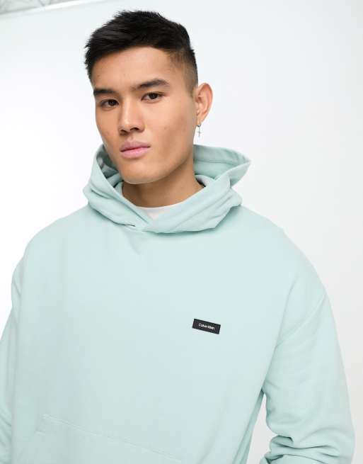 Calvin Klein Bequemer Kapuzenpullover in Minzgrun mit kastigem Logo ASOS