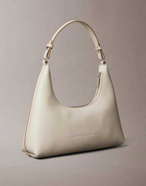 Calvin Klein – Beżowa skórzana torebka na ramię