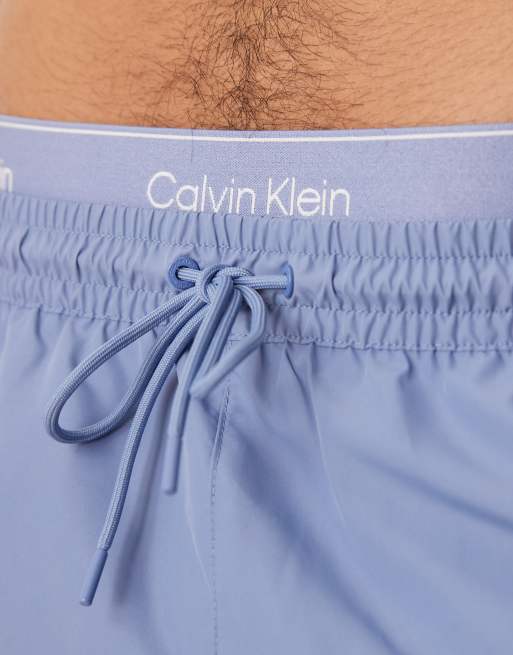 Calvin Klein – Blå badshorts med dragsko och logga på midjebandet, 4 av 4