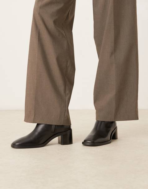 Calvin Klein block heel pointy boots in black - view 1