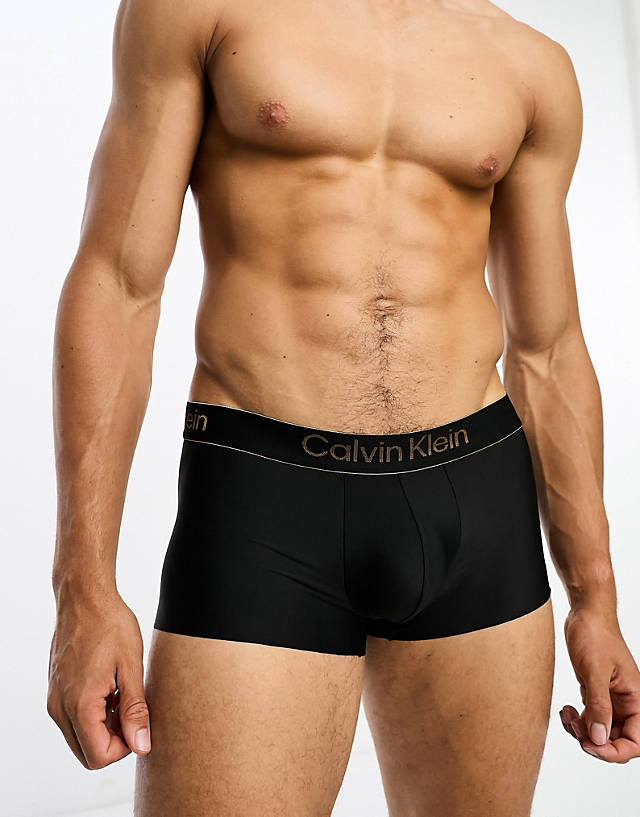 Calvin Klein - ck black low rise trunk in black with gold logo waistband