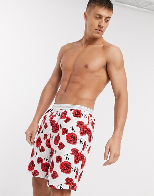 Calvin Klein CK One woven rose print lounge shorts in white
