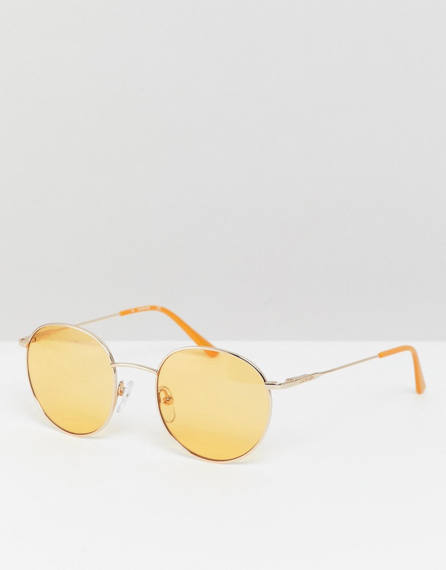 Calvin Klein - CK18104S - Runde gyldne solbriller med gule glas-Guld