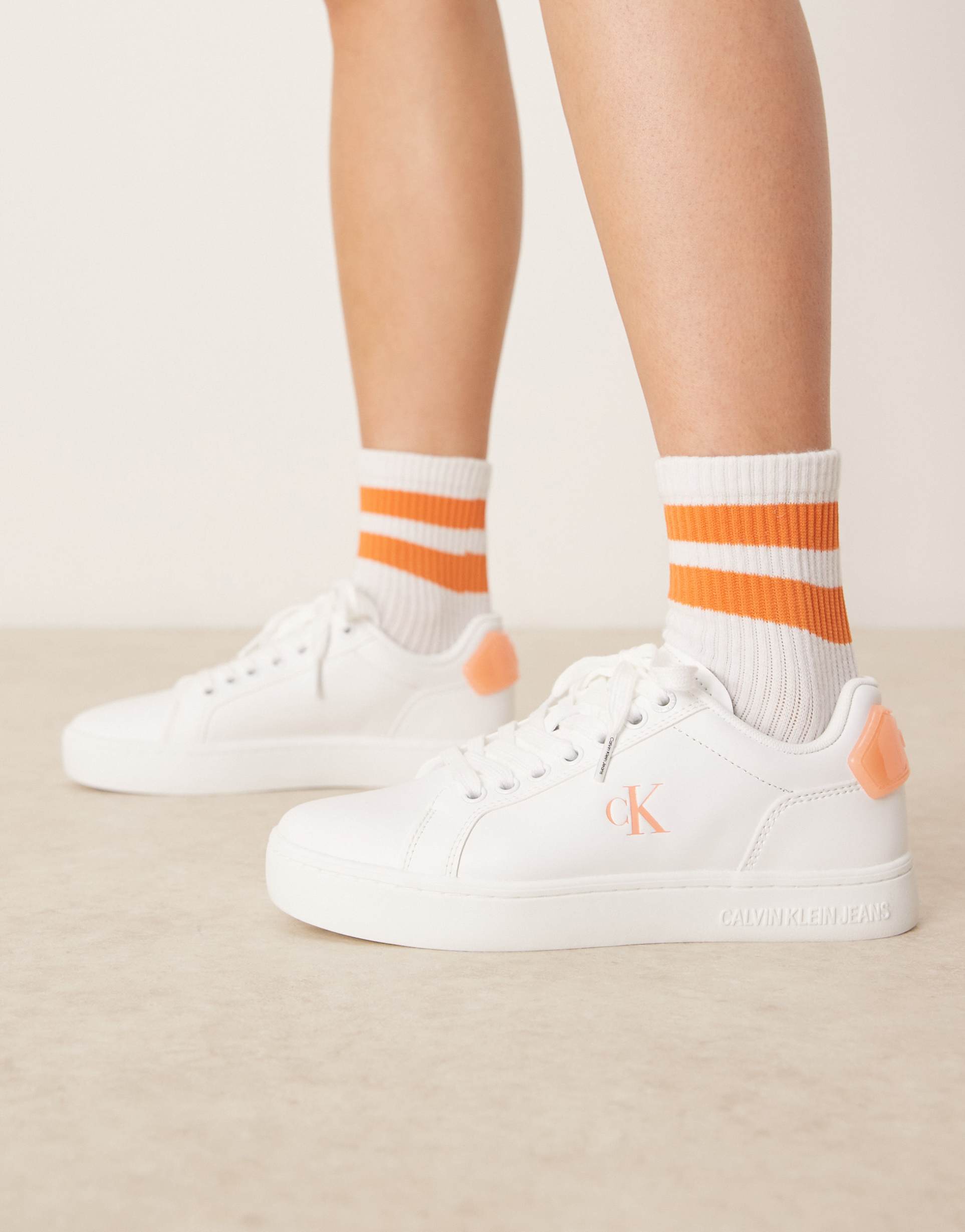 calvin klein classic cupsole sneakers in white and orange