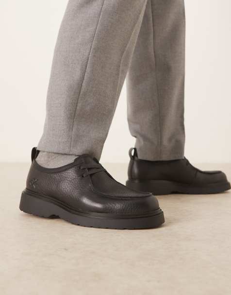 Calvin Klein – Combat – Czarne sznurowane skórzane buty - view 1