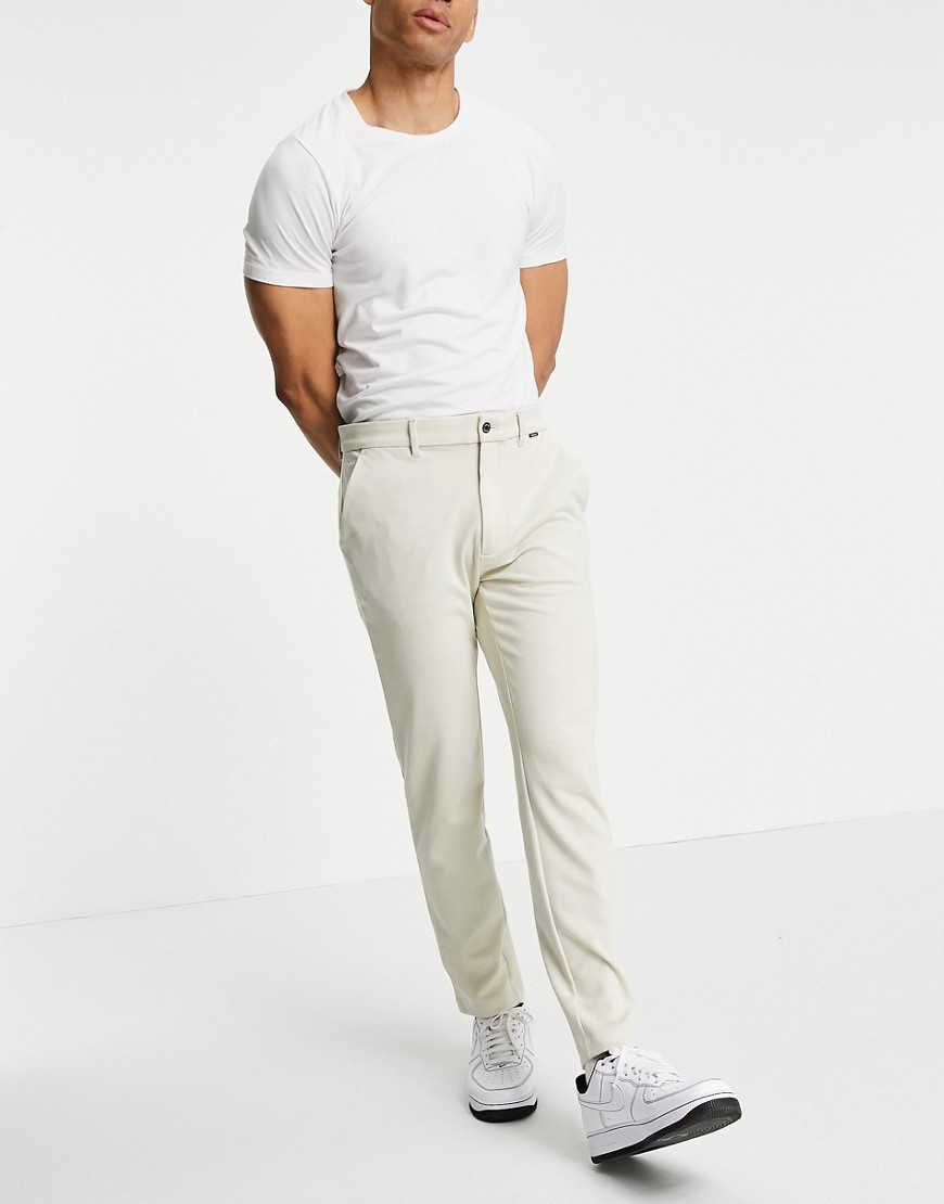 Calvin Klein comfort knit slim fit chino trousers in bleached stone-Neutral