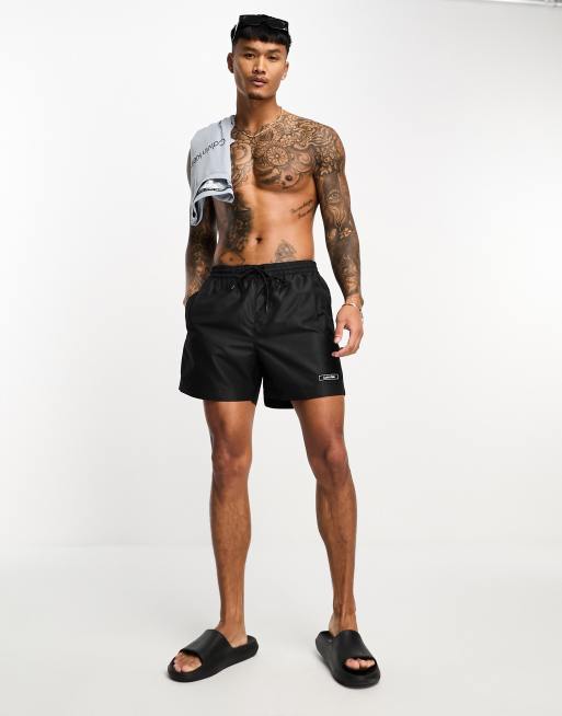 Calvin Klein core logo tape short drawstring swim shorts in black ASOS