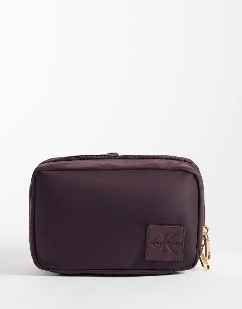 Calvin Klein cosmetic pouch in `burgundy - view 1