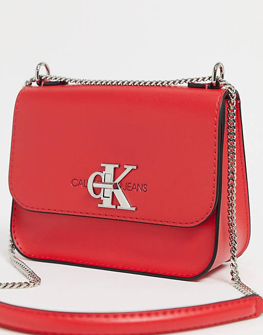 Calvin Klein cross body bag with chains in red | ASOS