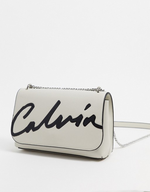 Calvin Klein cross body bag with script logo in stone