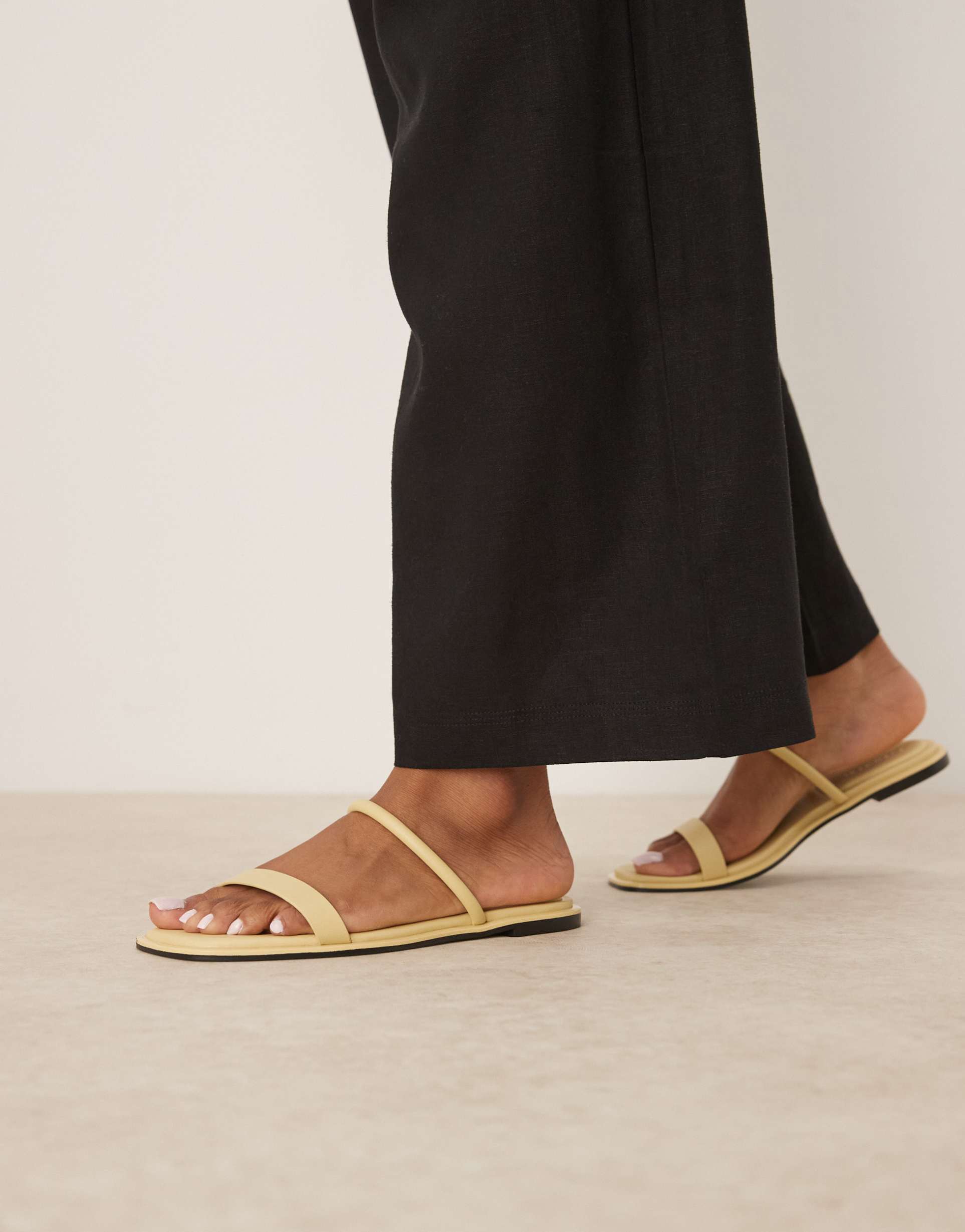 calvin klein double strap flat sandals in butter yellow