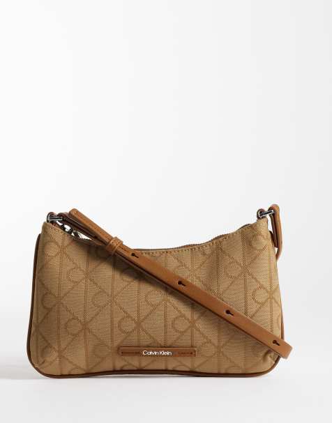 Calvin Klein emblem jacquard print mini bag in beige - view 1