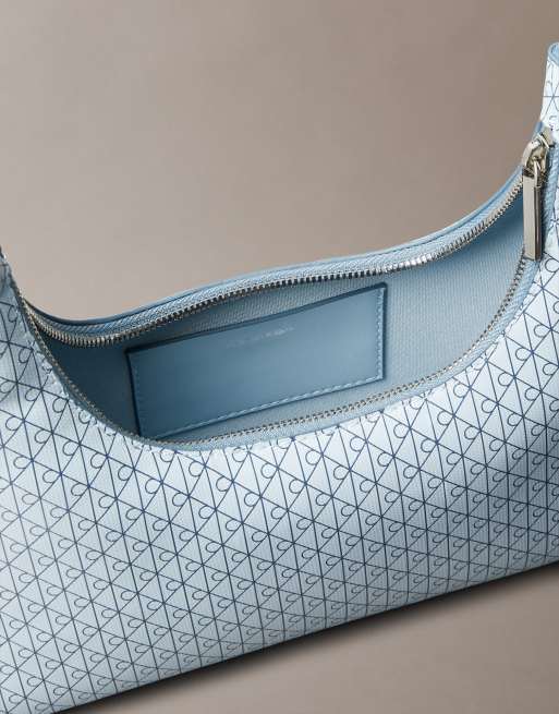 Calvin Klein emblem monogram logo shoulder bag in light blue