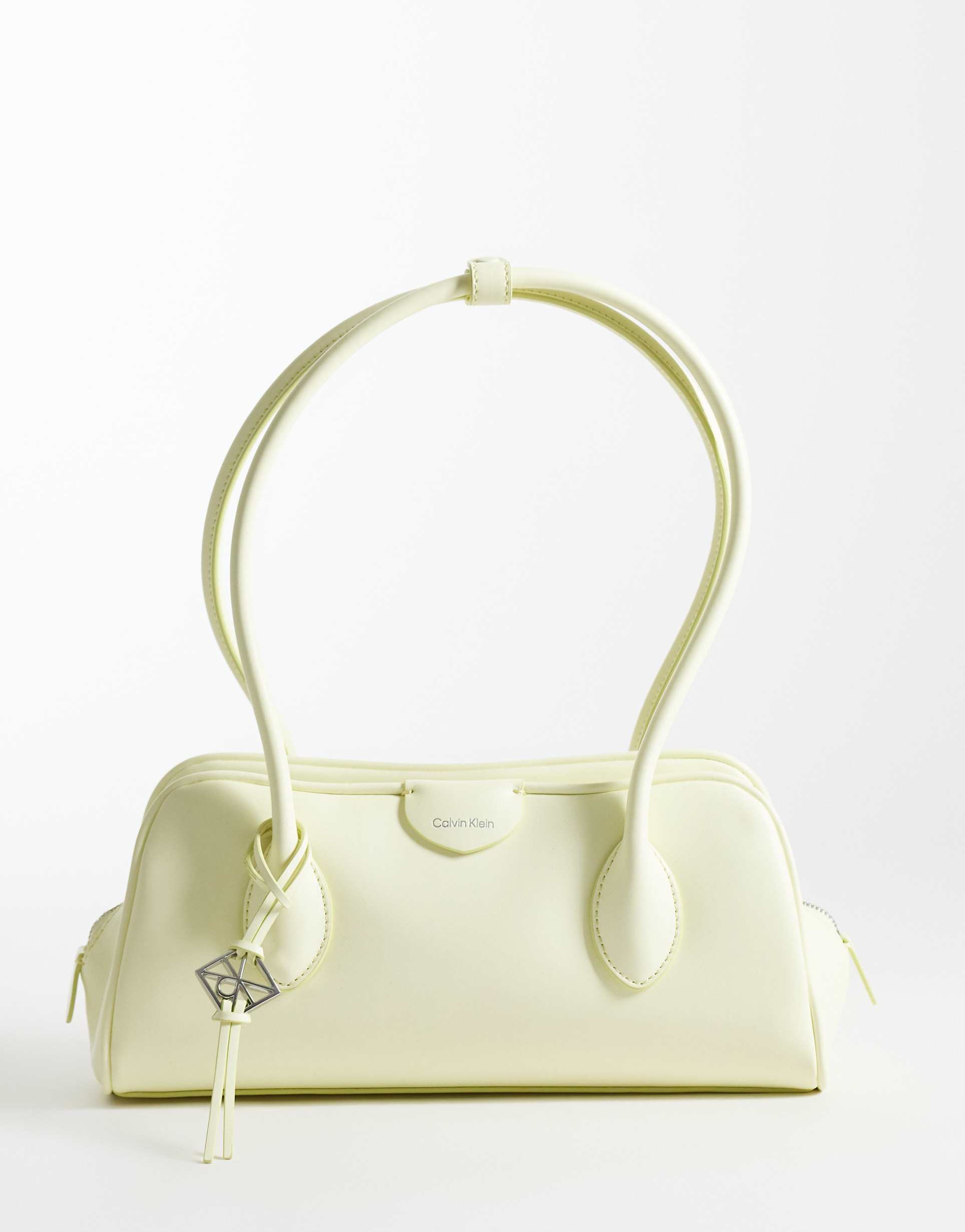 calvin klein emblem pebble shoulder bag in lemon yellow