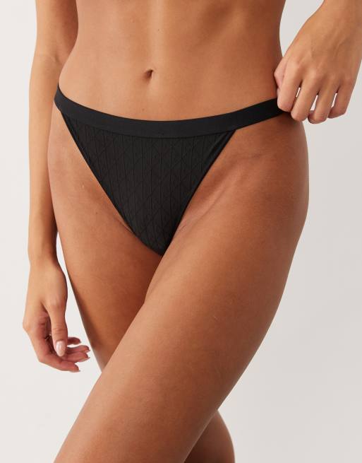 Calvin Klein embossed emblem string lingerie thong in black, 2 of 4