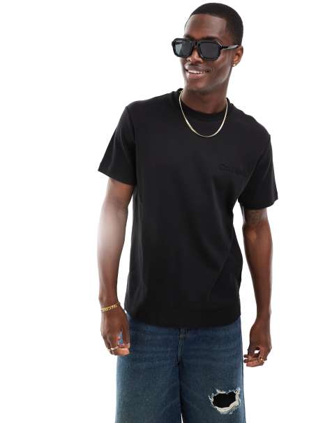 Calvin Klein embossed logo t-shirt in black - view 1