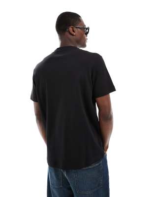 Shop Calvin Klein Embossed Logo T-shirt In Black