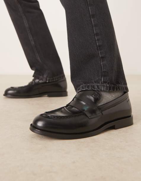 Calvin Klein Essential penny loafer brand detail in black - view 1