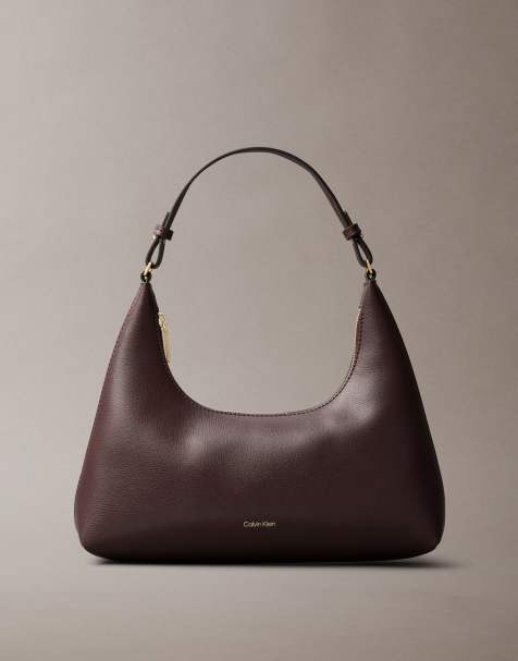 Calvin Klein faux leather shoulder bag in burgundy - view 1
