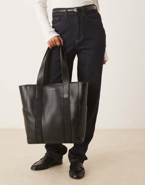 Calvin Klein faux leather strap tote bag in black - view 1