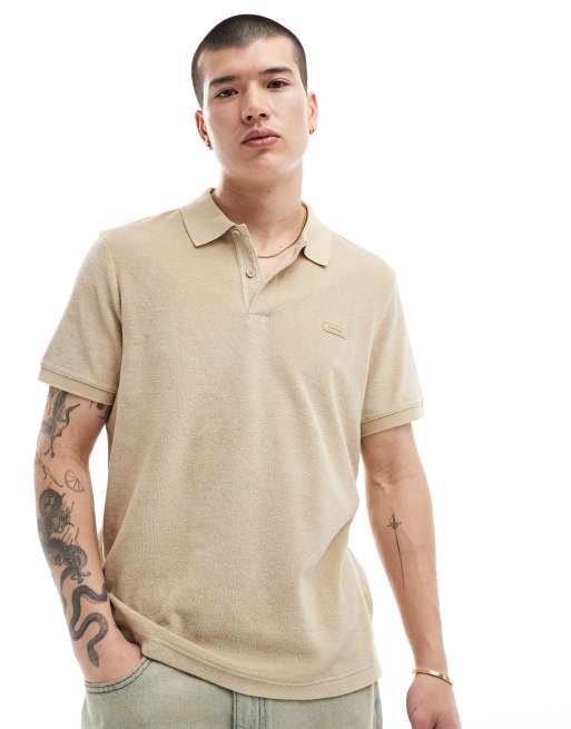 Calvin Klein – Frottee-Polohemd in Hellbraun