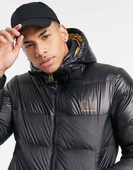 Black puffer jacket sales with gold zip