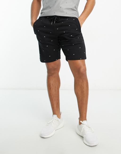 Calvin Klein - Golf Planet - Sorte shorts med monogramprint