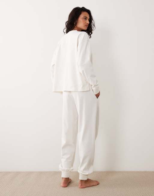 Calvin Klein – Gräddvita sweatpants i jersey med logga, del av set, 4 av 5