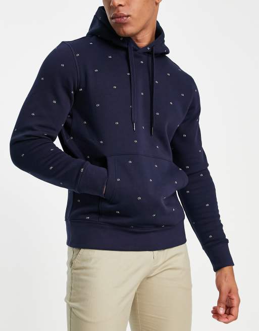 Calvin Klein – Granatowa bluza z kapturem i wzorem w monogram na całej powierzchni – tylko w ASOS