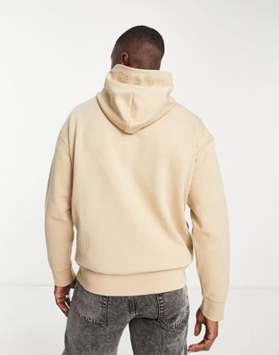 Calvin Klein half zip hoodie in tan - ASOS Price Checker