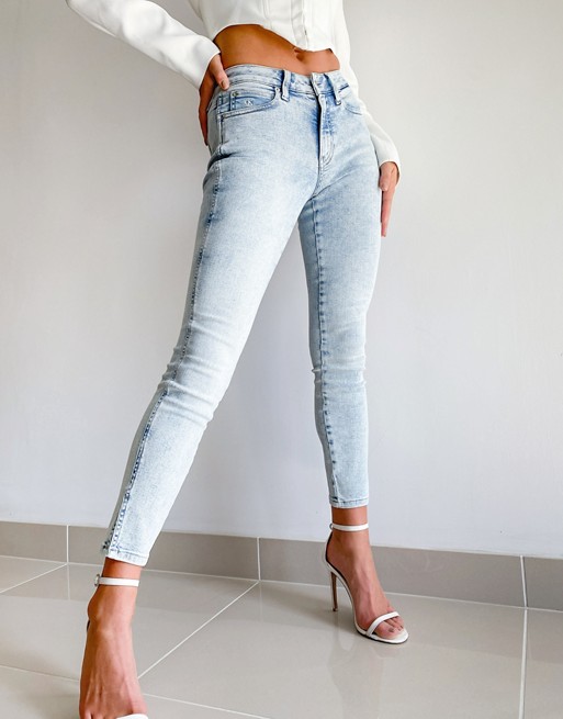 Calvin Klein high rise mid rise skinny jeans in bleached blue