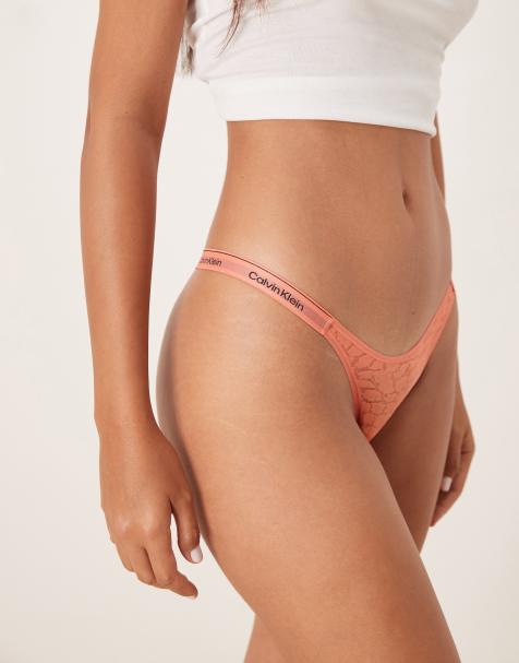 Calvin Klein Icon Lace dipped thong in coral orange
