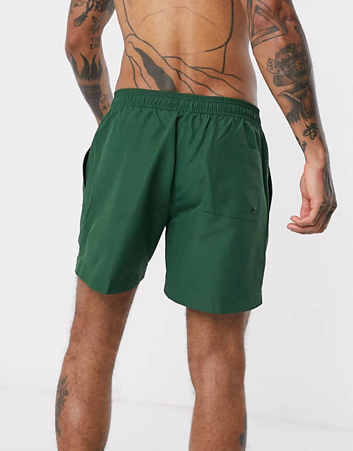 Calvin Klein Intense Power side logo swim shorts in green | ASOS