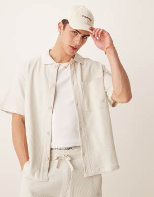 Calvin Klein Jean chunky waffle knit overshirt in off white-Neutral