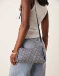[Calvin Klein Jeans] Calvin Klein Jeans 90s monogram logo shoulder bag in blue One Size BLUE INDIGO / ATMOS