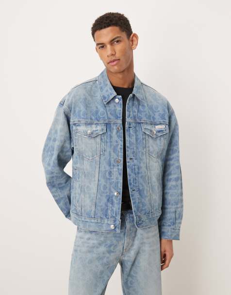 Calvin Klein Jeans all over logo denim trucker jacket co-ord in light wash blue - view 1