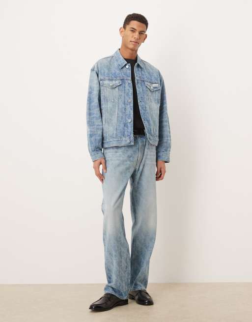 Calvin Klein Jeans all over logo denim trucker jacket co-ord in light wash blue, 2 of 5
