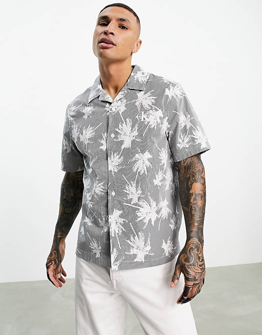 Calvin Klein Jeans all over palm print short sleeve shirt in black
