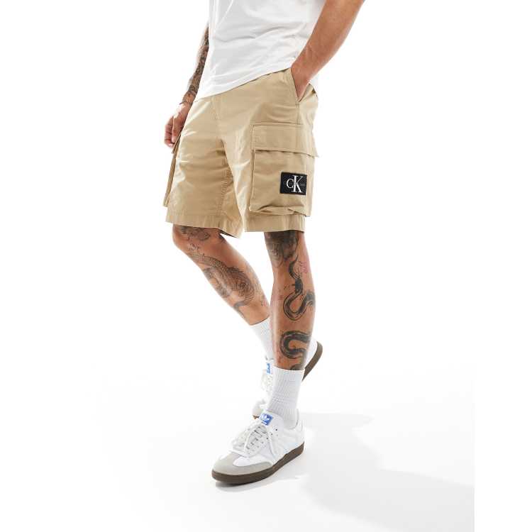 Calvin Klein Jeans badge cargo shorts in beige ASOS