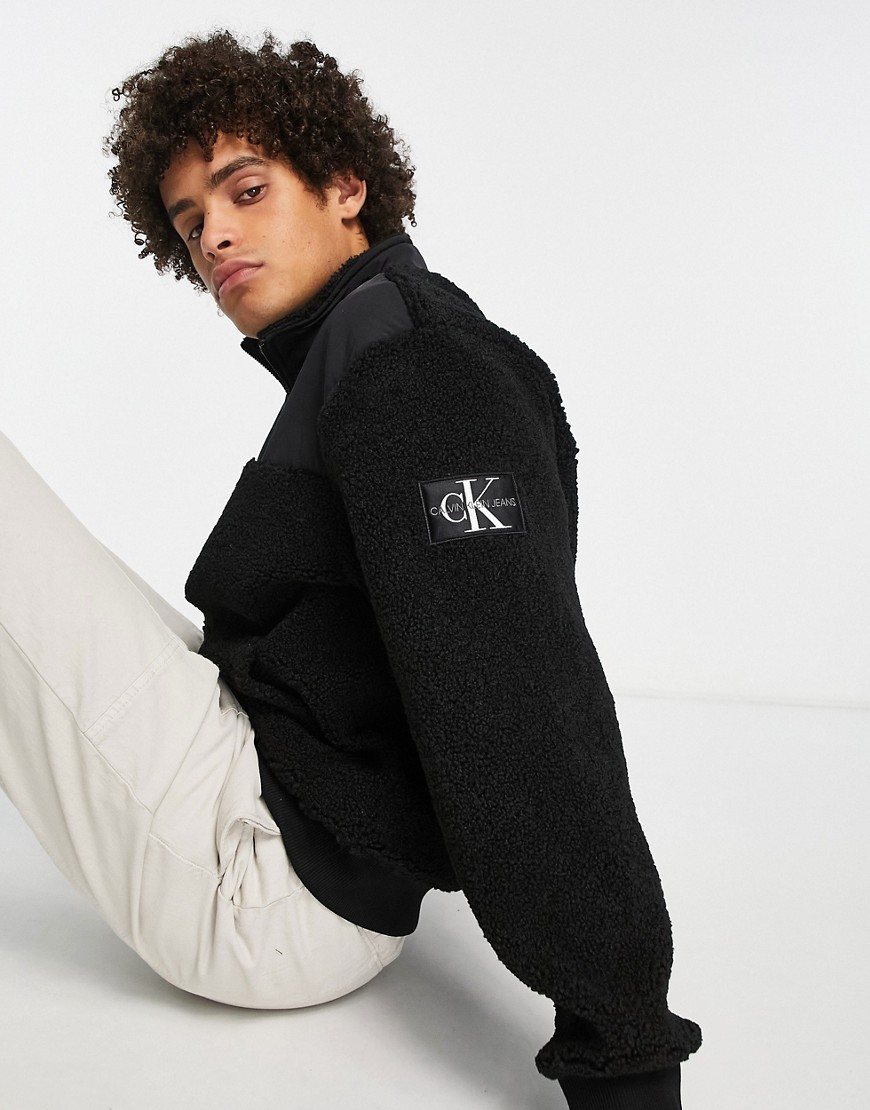 Calvin Klein Jeans badge logo sherpa borg half zip sweatshirt in black
