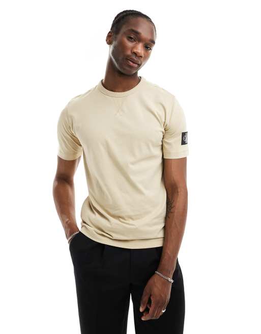 Calvin Klein Jeans badge logo t shirt in beige ASOS