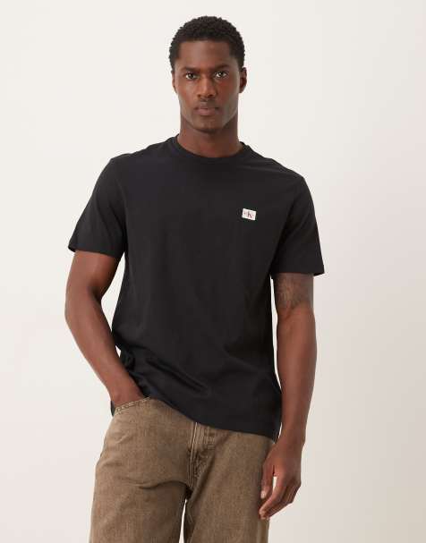 Calvin Klein Jeans badge logo t-shirt in black - view 1