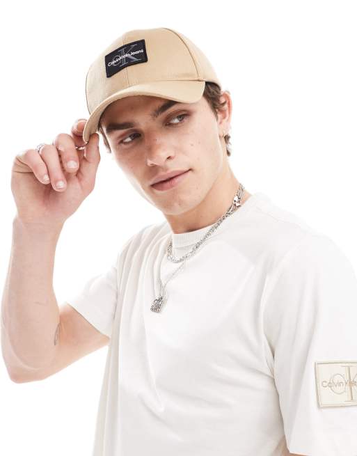 Calvin Klein Jeans – Beżowa czapka z daszkiem z logo z monogramem