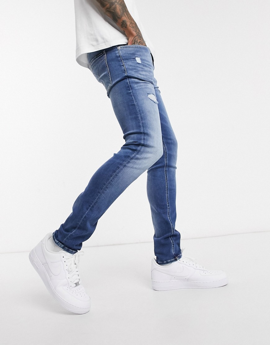 Calvin Klein Jeans – Blå skinny jeans med slitningar
