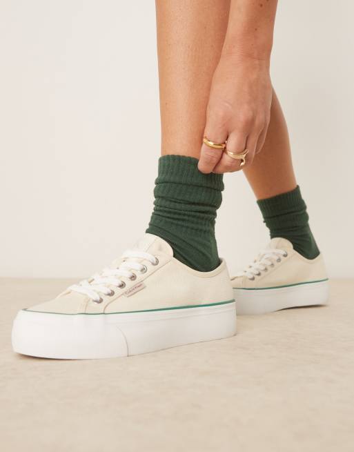 Calvin Klein Jeans - Canvas sneakers met gevulkaniseerde plateauzool in gebroken wit