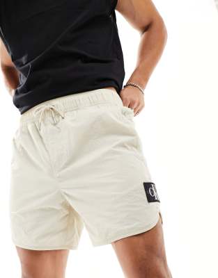Calvin Klein Jeans Calvin Klein Jeans cc badge logo shorts in beige-Neutral