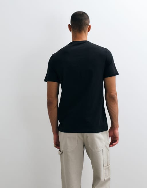 Calvin Klein Jeans centre logo graphic t-shirt in yellow black, 4 of 5
