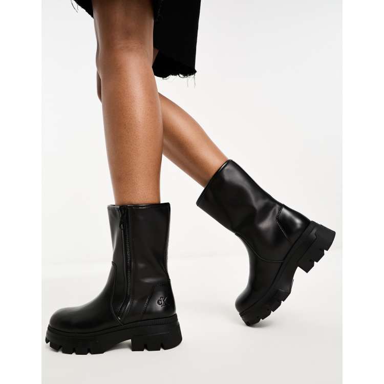 Calvin klein black sale boots with gold zipper