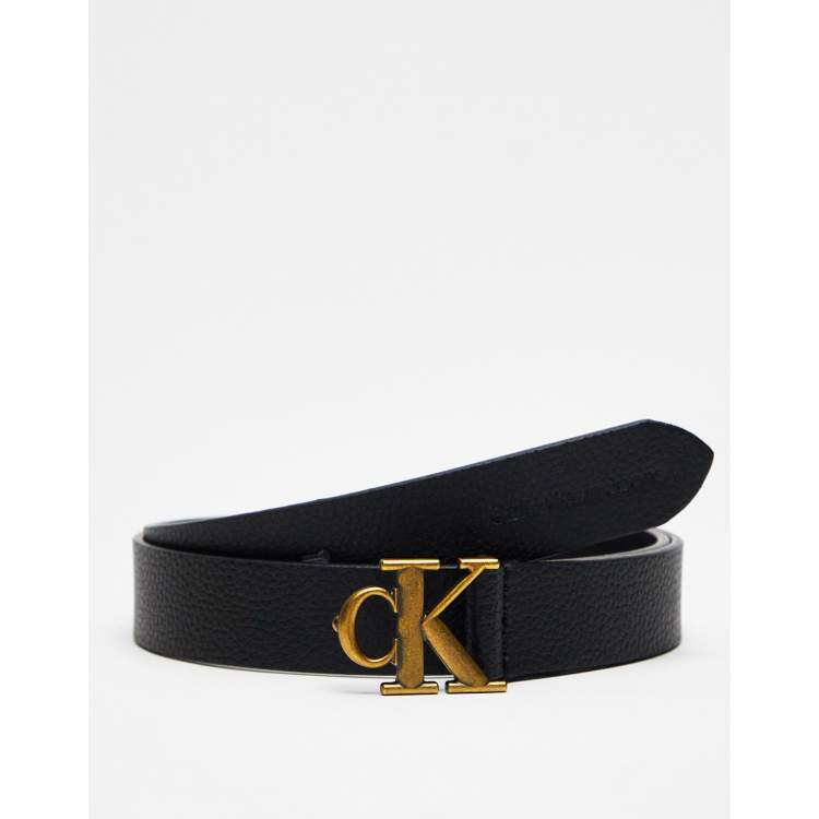 Calvin Klein cintura nera uomo in pelle con logo marchiato all over e  fibbia in metallo