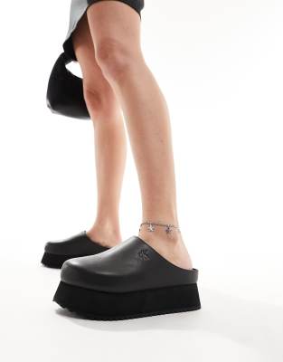 Calvin Klein Jeans closed toe flatform mules in black